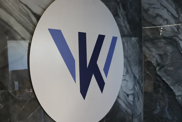 Kitchen Wrapper logo on the showroom wall